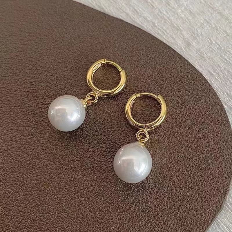 Boucles d'oreilles en cercles avec perles pendantes