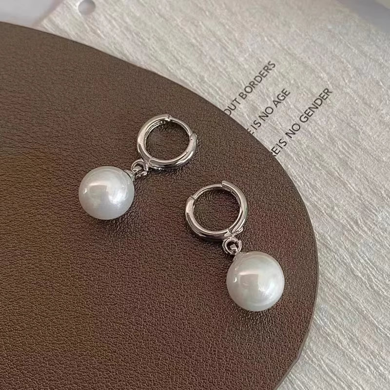 Boucles d'oreilles en cercles avec perles pendantes