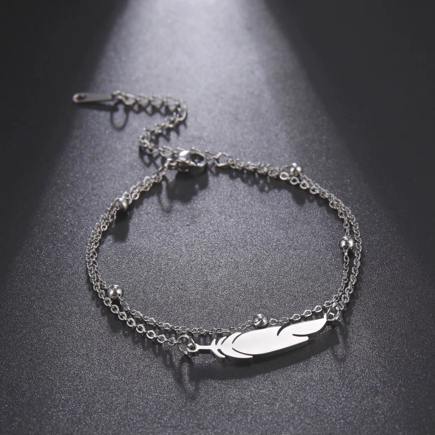 Chaines de cheville plume en acier inoxydable couleur or et argent