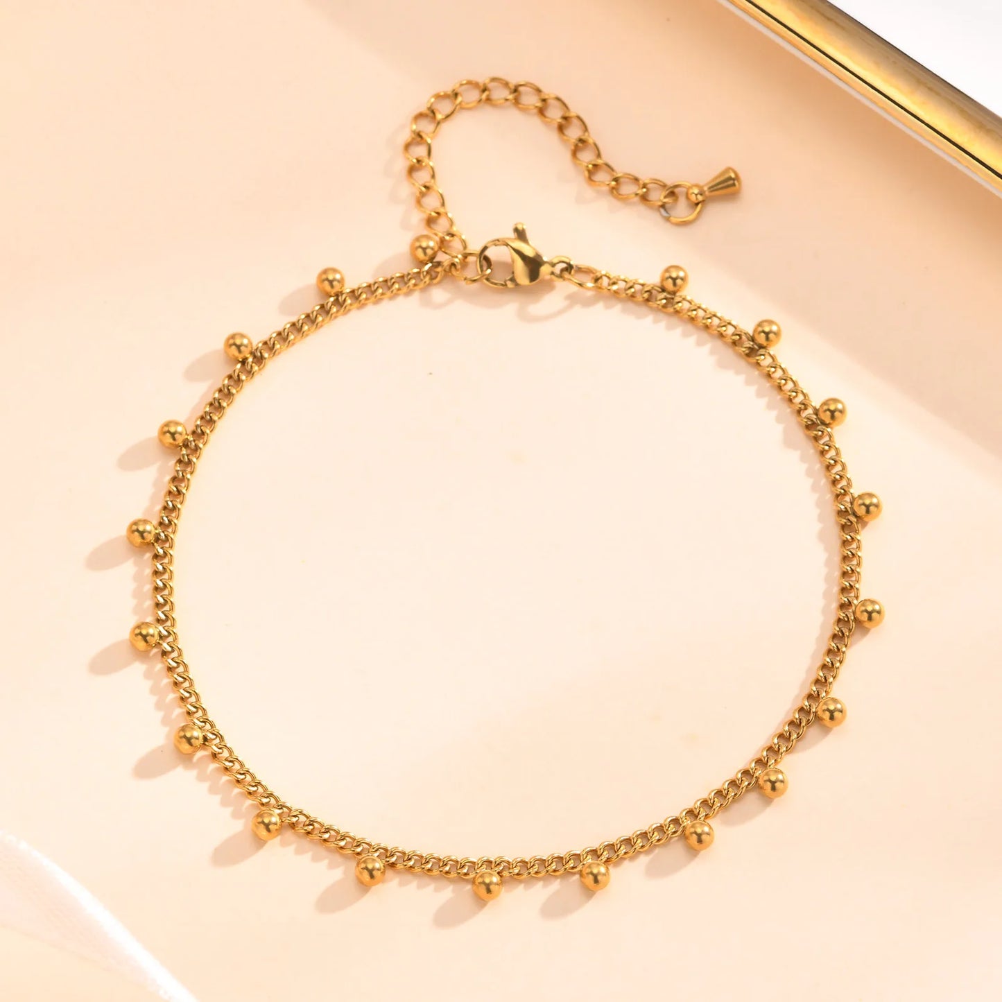 Chaine de cheville à perles dorés