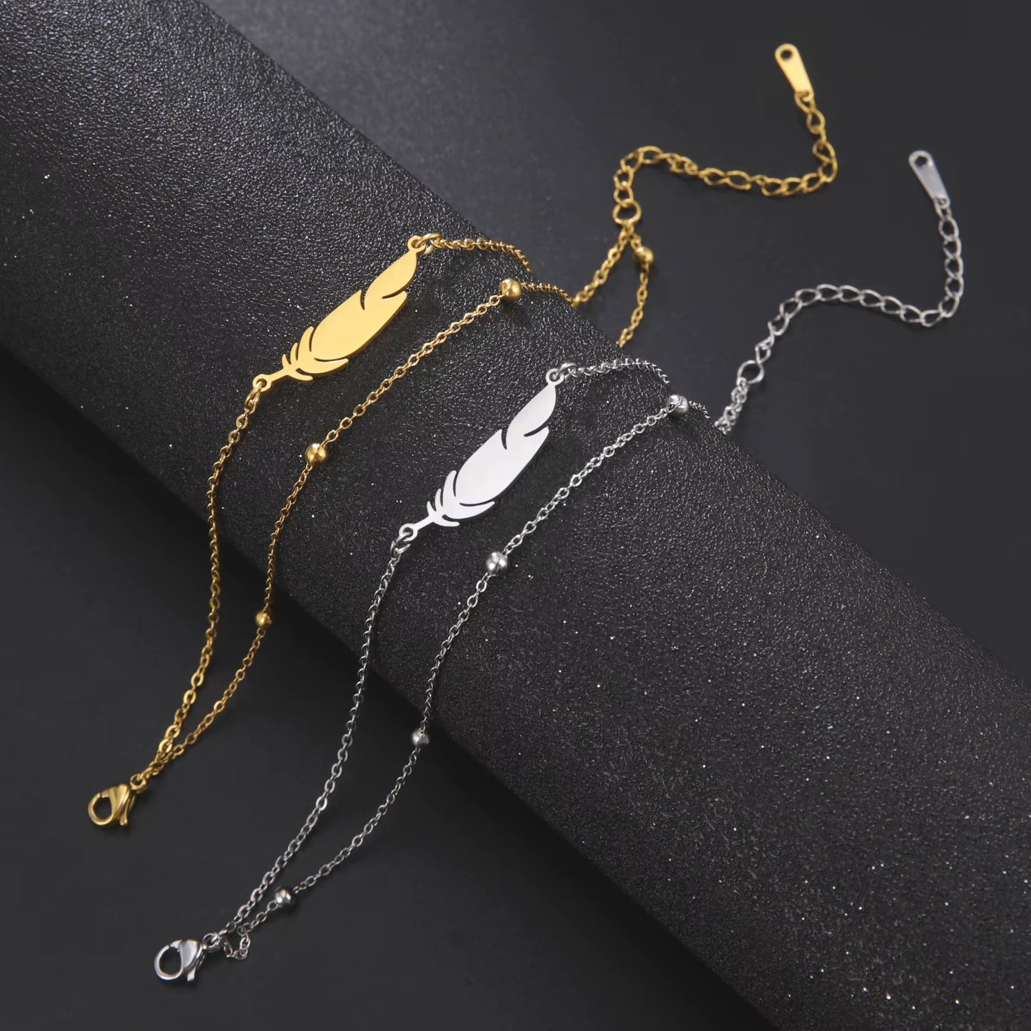 Chaines de cheville plume en acier inoxydable couleur or et argent