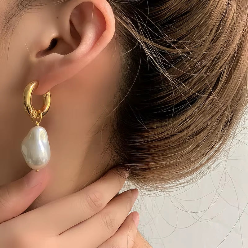 Boucles d'oreilles en cercles avec perles pendantes