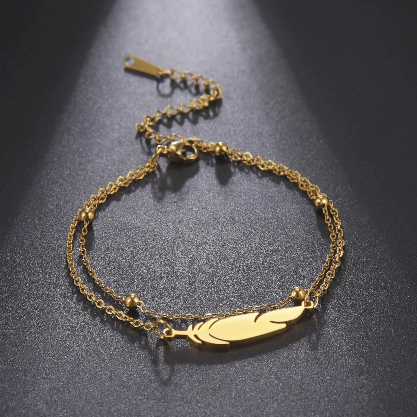Chaines de cheville plume en acier inoxydable couleur or et argent
