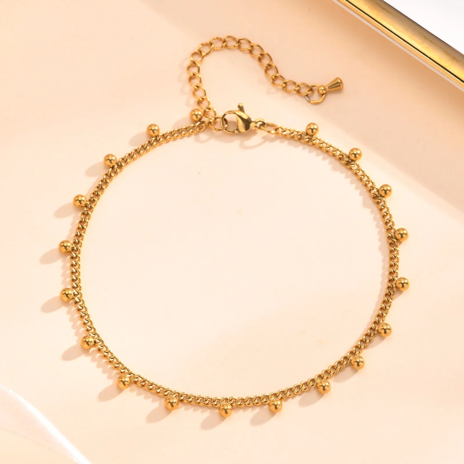 Chaine de cheville à perles dorés 