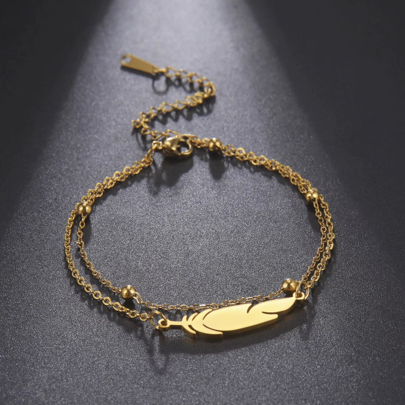 Chaines de cheville plume en acier inoxydable couleur or et argent